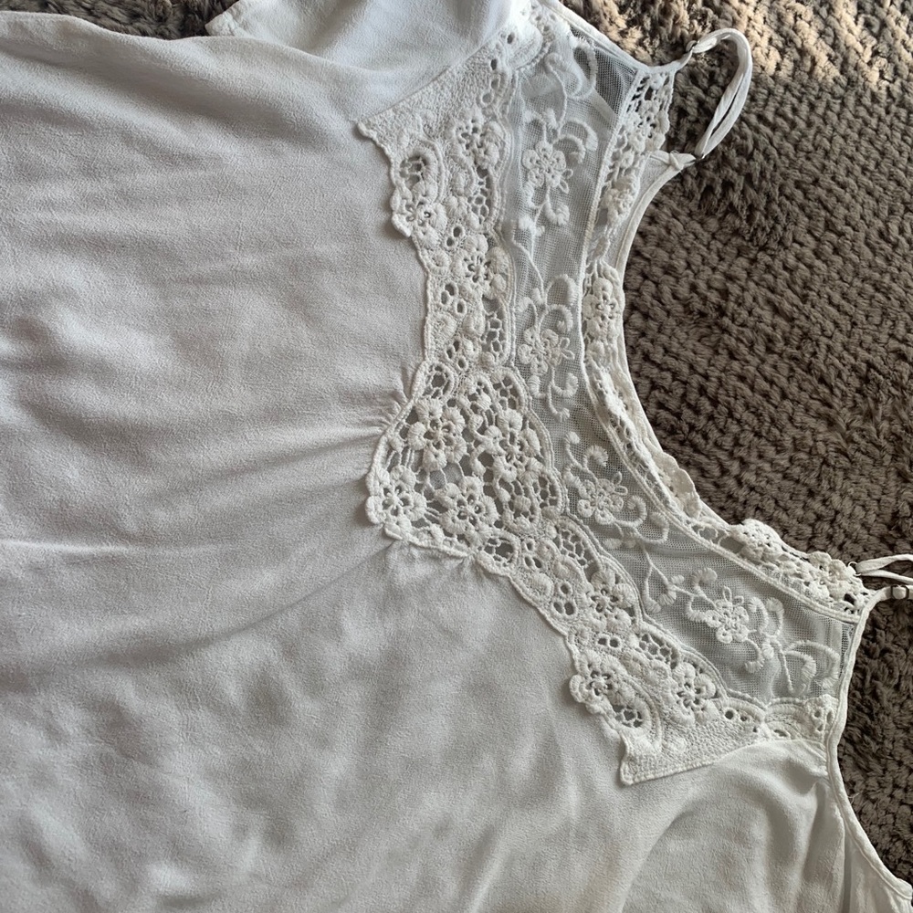 White blouse with open shoulder, with straps